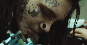 Movie still from “Alt-J - Left Hand Free” (2014), directed by Ryan Staake – Extreme Close Up shot, Low angle