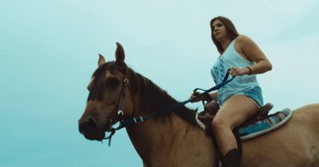 Movie still from “Alt-J - Left Hand Free” (2014), directed by Ryan Staake – Medium shot, Low angle