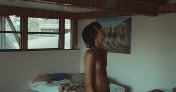 Movie still from “Alt-J - Left Hand Free” (2014), directed by Ryan Staake – Medium shot, Low angle