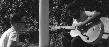 Movie still from “Paul McCartney - Early Days” (2014), directed by Vincent Haycock – Medium shot, Low angle