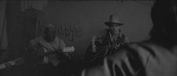 Movie still from “Paul McCartney - Early Days” (2014), directed by Vincent Haycock – Medium shot, Over the shoulder angle