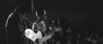 Movie still from “Paul McCartney - Early Days” (2014), directed by Vincent Haycock – Medium shot, Over the shoulder angle