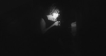 Movie still from “Timber Timbre - Curtains?!” (2014), directed by Tyler T. Williams – Medium shot, High angle