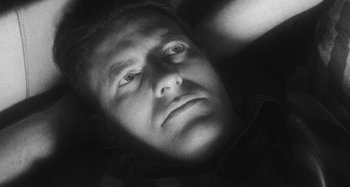 Movie still from “Timber Timbre - Curtains?!” (2014), directed by Tyler T. Williams – Extreme Close Up shot, Overhead angle