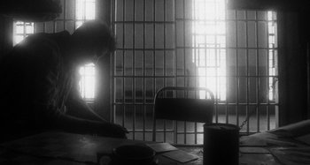 Movie still from “Timber Timbre - Curtains?!” (2014), directed by Tyler T. Williams – Medium shot, Low angle