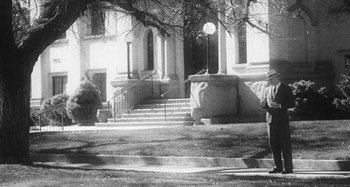 Movie still from “Timber Timbre - Curtains?!” (2014), directed by Tyler T. Williams – Wide shot, Low angle