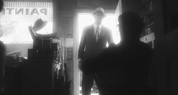 Movie still from “Timber Timbre - Curtains?!” (2014), directed by Tyler T. Williams – Medium shot, Over the shoulder angle