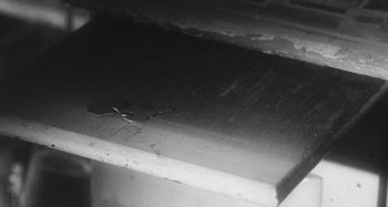 Movie still from “Timber Timbre - Curtains?!” (2014), directed by Tyler T. Williams – Extreme Close Up shot, Overhead angle