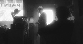 Movie still from “Timber Timbre - Curtains?!” (2014), directed by Tyler T. Williams – Medium shot, Low angle