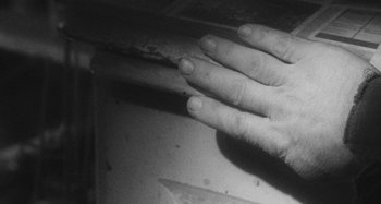 Movie still from “Timber Timbre - Curtains?!” (2014), directed by Tyler T. Williams – Extreme Close Up shot, Overhead angle