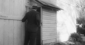 Movie still from “Timber Timbre - Curtains?!” (2014), directed by Tyler T. Williams – Wide shot, Low angle