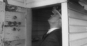 Movie still from “Timber Timbre - Curtains?!” (2014), directed by Tyler T. Williams – Medium shot, Low angle