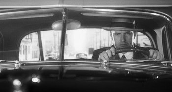 Movie still from “Timber Timbre - Curtains?!” (2014), directed by Tyler T. Williams – Medium shot, Low angle