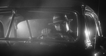 Movie still from “Timber Timbre - Curtains?!” (2014), directed by Tyler T. Williams – Medium shot, Low angle