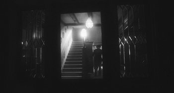 Movie still from “Timber Timbre - Curtains?!” (2014), directed by Tyler T. Williams – Wide shot, Low angle