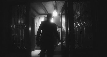 Movie still from “Timber Timbre - Curtains?!” (2014), directed by Tyler T. Williams – Medium shot, Low angle