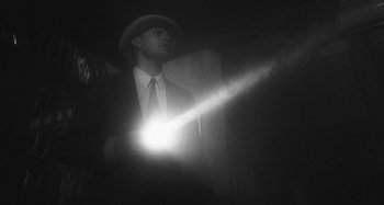 Movie still from “Timber Timbre - Curtains?!” (2014), directed by Tyler T. Williams – Medium shot, Low angle