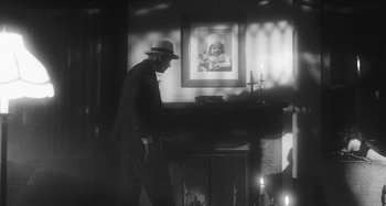 Movie still from “Timber Timbre - Curtains?!” (2014), directed by Tyler T. Williams – Medium shot, Low angle