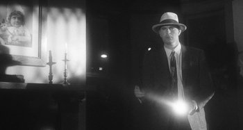 Movie still from “Timber Timbre - Curtains?!” (2014), directed by Tyler T. Williams – Medium shot, Low angle