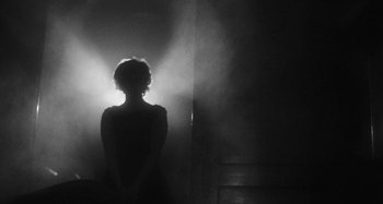 Movie still from “Timber Timbre - Curtains?!” (2014), directed by Tyler T. Williams – Medium shot, Low angle