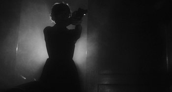 Movie still from “Timber Timbre - Curtains?!” (2014), directed by Tyler T. Williams – Medium shot, Low angle