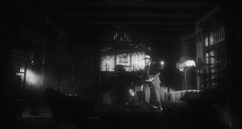 Movie still from “Timber Timbre - Curtains?!” (2014), directed by Tyler T. Williams – Wide shot, Low angle