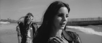 Movie still from “Lana Del Ray - West Coast” (2014), directed by Vincent Haycock – Close Up shot, Over the shoulder angle