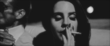Movie still from “Lana Del Ray - West Coast” (2014), directed by Vincent Haycock – Close Up shot, High angle