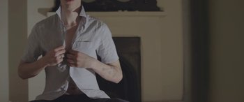 Movie still from “Lyla Foy - Feather Tongue” (2014), directed by Oscar Hudson – Medium shot, High angle