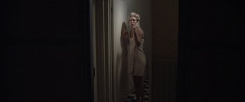 Movie still from “Lyla Foy - Feather Tongue” (2014), directed by Oscar Hudson – Medium shot, Low angle