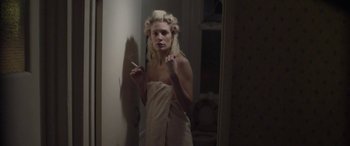 Movie still from “Lyla Foy - Feather Tongue” (2014), directed by Oscar Hudson – Medium shot, Low angle