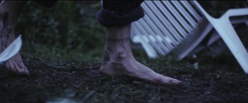 Movie still from “Lyla Foy - Feather Tongue” (2014), directed by Oscar Hudson – Extreme Close Up shot, High angle