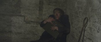 Movie still from “Lyla Foy - Feather Tongue” (2014), directed by Oscar Hudson – Medium shot, Overhead angle