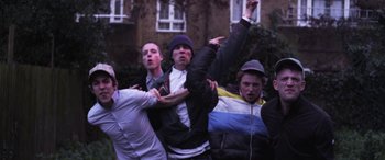Movie still from “Lyla Foy - Feather Tongue” (2014), directed by Oscar Hudson – Medium shot, Low angle