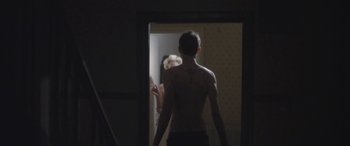 Movie still from “Lyla Foy - Feather Tongue” (2014), directed by Oscar Hudson – Medium shot, Over the shoulder angle
