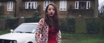 Movie still from “Lyla Foy - Feather Tongue” (2014), directed by Oscar Hudson – Medium shot, Low angle
