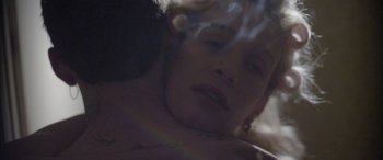 Movie still from “Lyla Foy - Feather Tongue” (2014), directed by Oscar Hudson – Extreme Close Up shot, Over the shoulder angle
