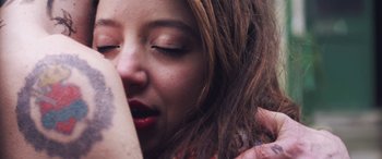 Movie still from “Lyla Foy - Feather Tongue” (2014), directed by Oscar Hudson – Extreme Close Up shot, Overhead angle