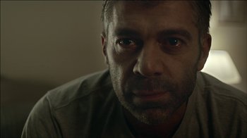 Movie still from “ALB - Whispers” (2014), directed by Casper Balslev – Close Up shot, Low angle