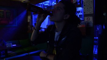 Movie still from “Arctic Monkeys - Why’d You Only Call Me When You’re High?” (2013), directed by Nabil Elderkin – Close Up shot, Low angle