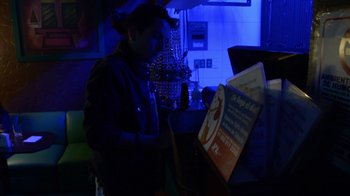 Movie still from “Arctic Monkeys - Why’d You Only Call Me When You’re High?” (2013), directed by Nabil Elderkin – Medium shot, Low angle