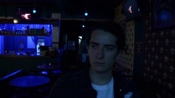 Movie still from “Arctic Monkeys - Why’d You Only Call Me When You’re High?” (2013), directed by Nabil Elderkin – Close Up shot, Low angle