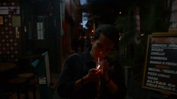 Movie still from “Arctic Monkeys - Why’d You Only Call Me When You’re High?” (2013), directed by Nabil Elderkin – Close Up shot, High angle