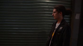 Movie still from “Arctic Monkeys - Why’d You Only Call Me When You’re High?” (2013), directed by Nabil Elderkin – Medium shot, Low angle