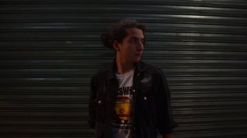 Movie still from “Arctic Monkeys - Why’d You Only Call Me When You’re High?” (2013), directed by Nabil Elderkin – Medium shot, Low angle