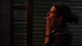 Movie still from “Arctic Monkeys - Why’d You Only Call Me When You’re High?” (2013), directed by Nabil Elderkin – Close Up shot, High angle