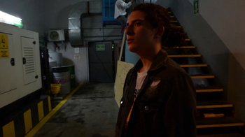 Movie still from “Arctic Monkeys - Why’d You Only Call Me When You’re High?” (2013), directed by Nabil Elderkin – Medium shot, Low angle