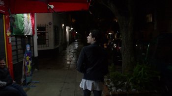 Movie still from “Arctic Monkeys - Why’d You Only Call Me When You’re High?” (2013), directed by Nabil Elderkin – Wide shot, Low angle