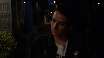 Movie still from “Arctic Monkeys - Why’d You Only Call Me When You’re High?” (2013), directed by Nabil Elderkin – Close Up shot, High angle