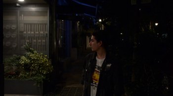 Movie still from “Arctic Monkeys - Why’d You Only Call Me When You’re High?” (2013), directed by Nabil Elderkin – Medium shot, Over the shoulder angle